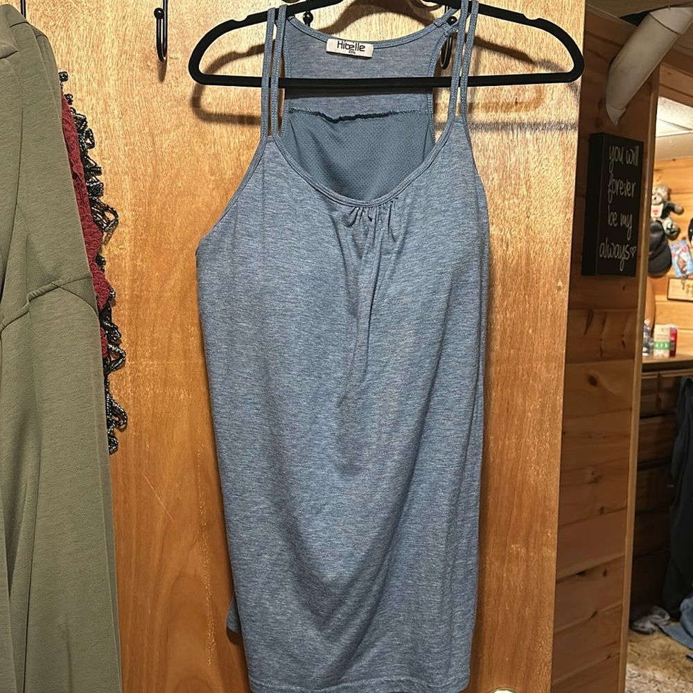 3 tank tops. One blue one red one pinkish peach.
